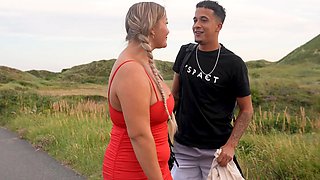 A fat woman has sex with her husband on the beach in a steamy scene.