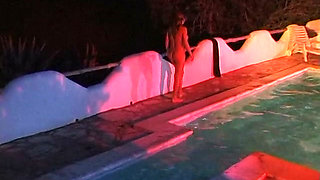 Two sexy lesbian chicks are swimming together in the swimming pool