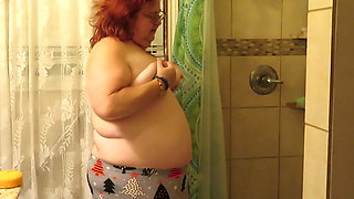 Step mom cleaning bathroom thinks of her step son watching