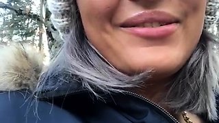 Outdoor solo masturbation scene with curly blonde
