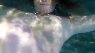 Sunny Lane sucks cock underwater