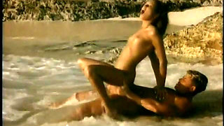 Lusty Brunette Rides a Long Hard Cock in the Ocean