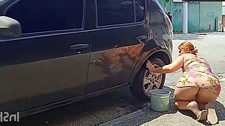 HOT GIRL WASHES HER CAR SHOWING OFF ON THE STREET