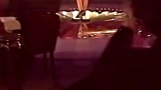 Blonde Stripper Bends Showing Shaved Pussy