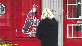 Young girl pissing on street