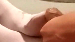 MILF in Pantyhose and Heels Gives a Footjob