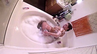 Stacked MILF masturbating in bathtub