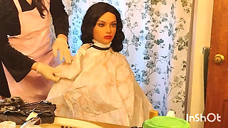 Emma the barberette shows off sexy vinyl shampoo capes