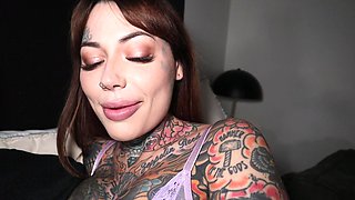 Tattooed bitch squeezes her big tits while being smashed