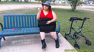 Nurse Vicki Smoking in the Park on a Bench All Dressed up