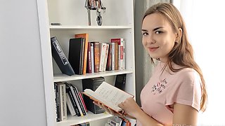 A hot blonde in a miniskirt masturbates her bald pussy