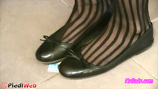 Nyllady Footplaying with a Phone Card in Patent Black Stockings