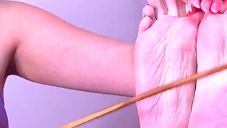This Time No Fun for Bia Roman, Bastinado with Cane on Her Soles