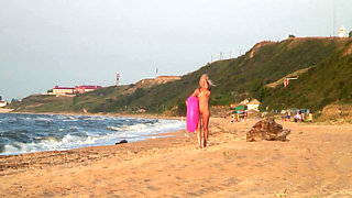 Hot naked blonde on the beach
