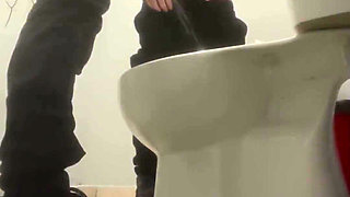 Amateur Friends Pissing Together in the Club's Toilets