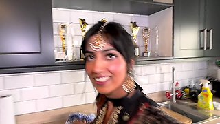 Desi babe is getting really thirsty for some hard cock in the kitchen