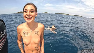 Lesbian sex of two young beauties on the yacht in nature