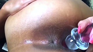 Ebony fingers her butt pussy creams