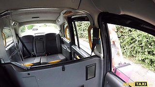 Blonde with tattoos sucks in the FakeTaxi back seat by the woods