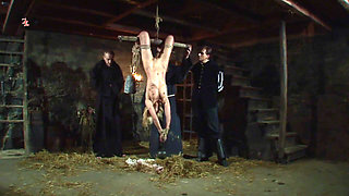 Witch Hangs Upside Down and Gets Drizzled with Black Wax