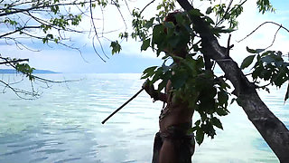 Fishing with harpoon in topless