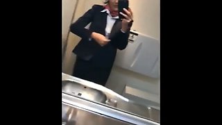 Naughty stewardess with hot tits masturbates in toilet