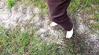 Completely Naked Through the Woods While Slapping Her Breasts