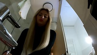 Big Tits Big Ass Hot Blonde Babe in Pantyhose and High Heels with a Miniskirt does a Striptease in the Bathroom