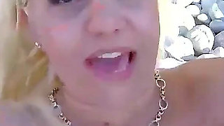 The blonde milf Debora met her stepbrother on the beach for a swim