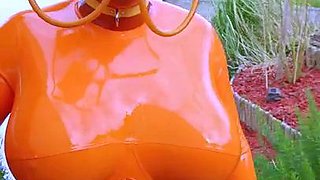 Big breasted amateur MILF freak posing in latex outfit