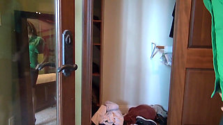 Sexy lesbian couple kiss passionately as they undress each other