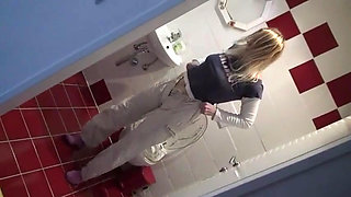 Blonde bitch pissing at home