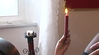 Playing with candles and her pussy