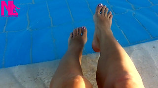 Barefoot Dangling in Swimming Pool Water