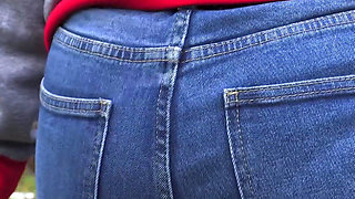 MILF In Blue Jeans Bends Over And Flashing Her Big Ass Outdoors
