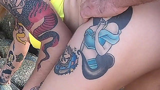 Tattooed MILF Nery Takes Hard Doggy Pounding on Beach