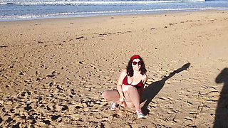 Woman Pissing on a Public Beach While No One Is There