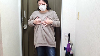 A Married Woman Masturbating Passionately in Front of the Entrance